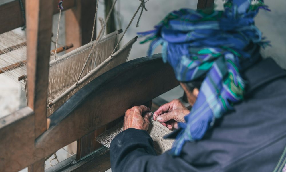 Бабушка вышивает