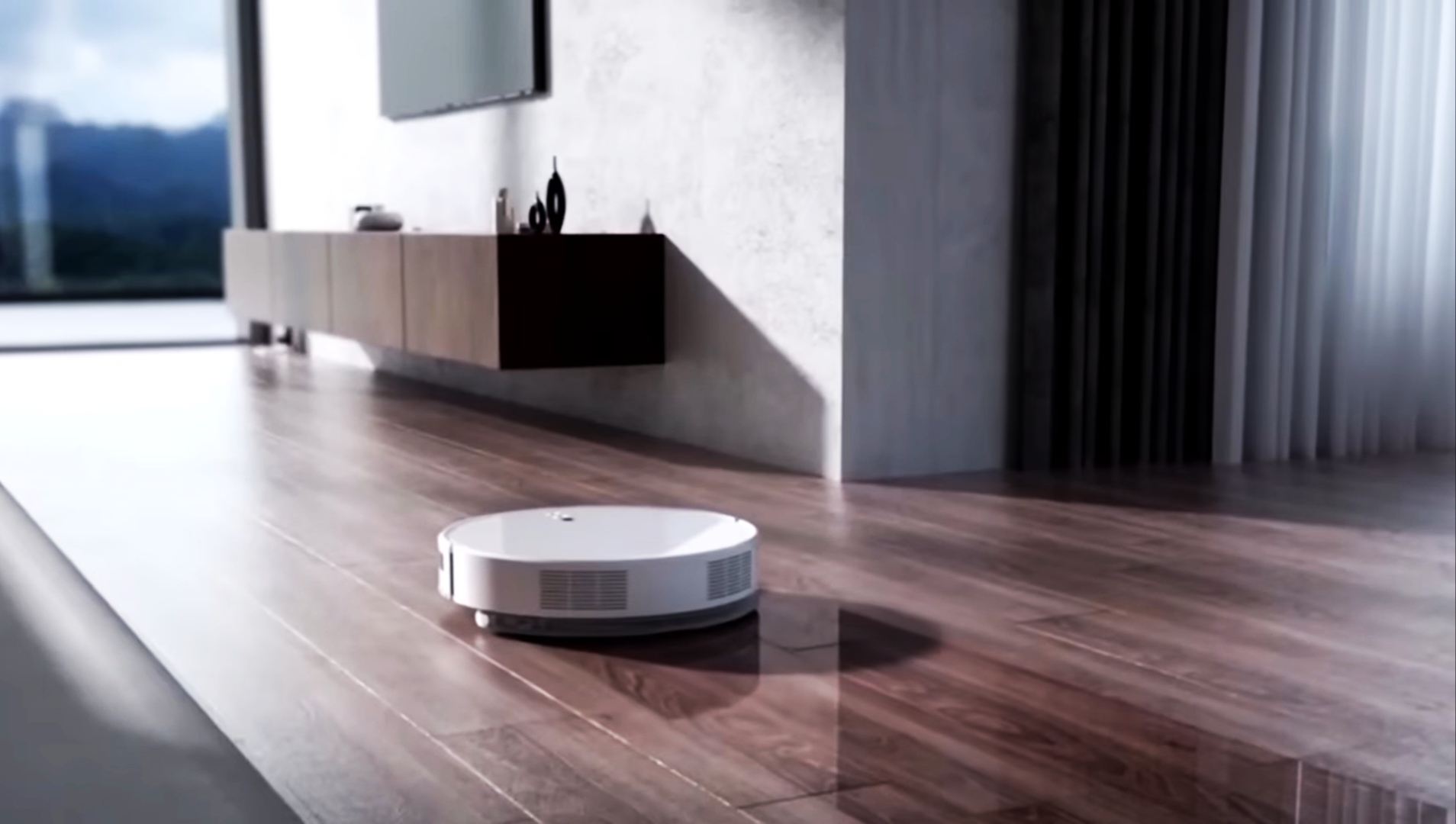 В комнате убирается робот-пылесос
